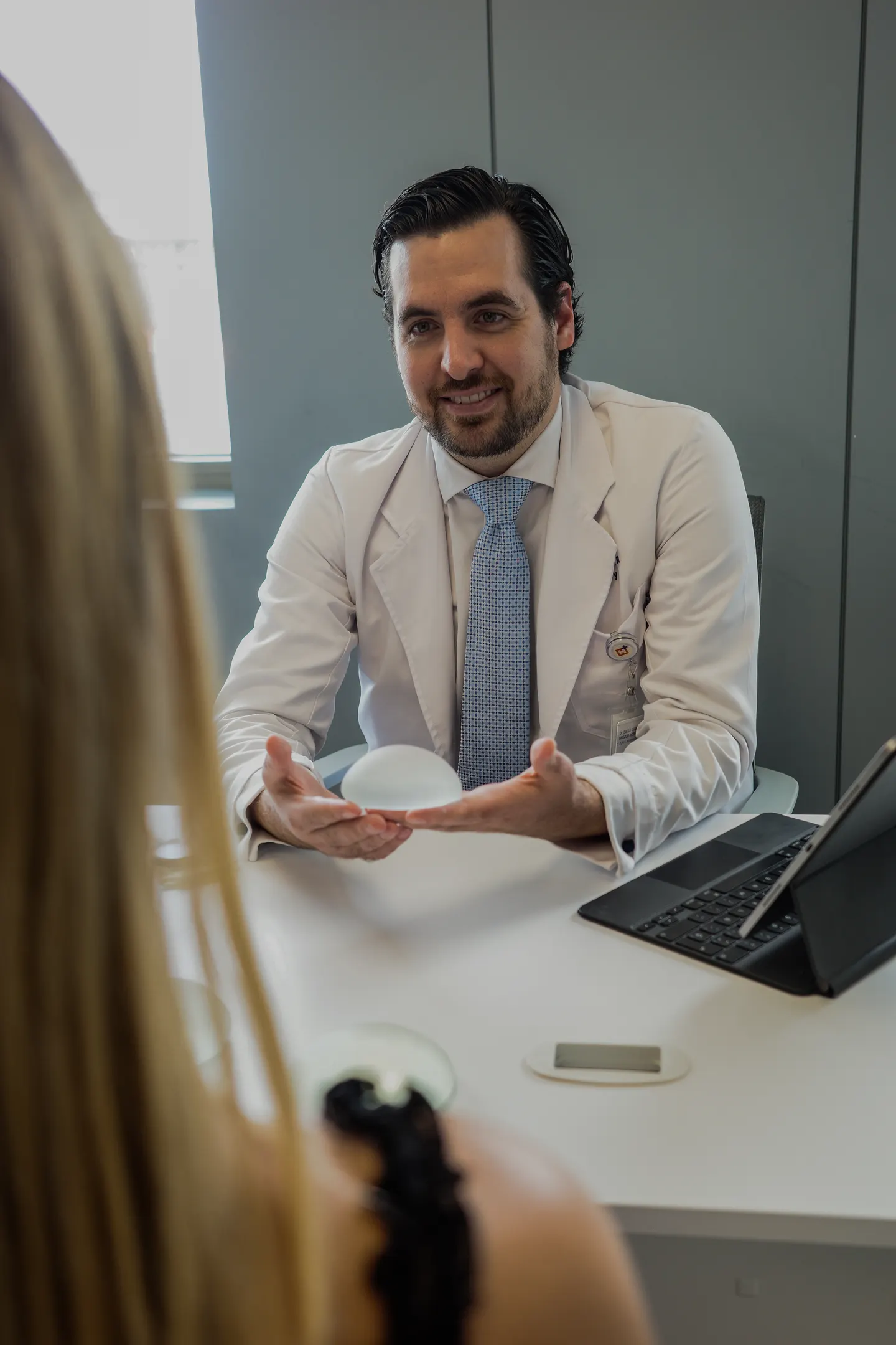 Dr. Guibaldo in consultation with a patient